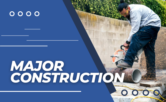 Major construction photograph of City worker cutting a water line