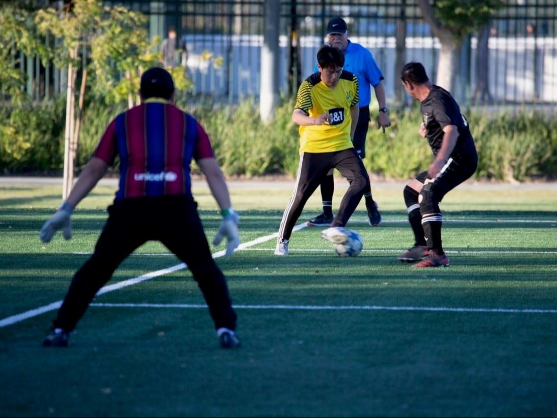 Adult Soccer Players on Field 